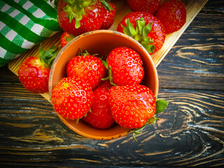 fresh strawberries on wooden background