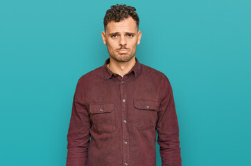 Young hispanic man wearing casual clothes depressed and worry for distress, crying angry and afraid. sad expression.