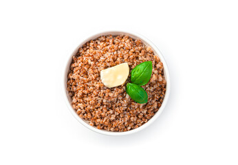 Healthy, natural buckwheat porridge with butter and basil isolated on white.