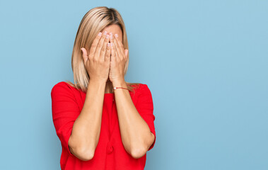 Middle age caucasian woman wearing casual clothes with sad expression covering face with hands while crying. depression concept.