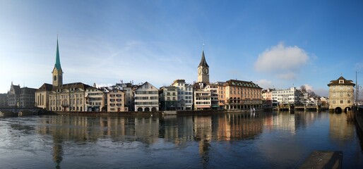 Wonderful day for sightseeing: Limmat river promenade in Zurich, Switzerland.