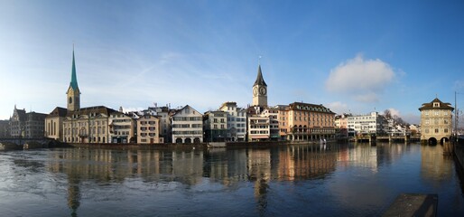 Fototapeta premium Wonderful day for sightseeing: Limmat river promenade in Zurich, Switzerland.