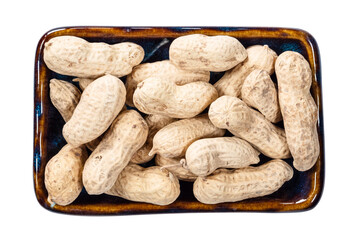 top view of unpeeled peanuts in bowl cutout