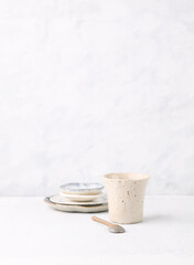 Traditional, handcrafted ceramic on bright wooden background. Soft focus. Copy space.	