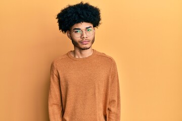 Fototapeta na wymiar Young african american man with afro hair wearing casual winter sweater skeptic and nervous, frowning upset because of problem. negative person.