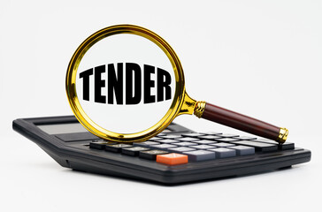 On a white background lies a calculator and a magnifying glass with the inscription - TENDER
