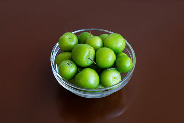  fresh green plum fruits on the table