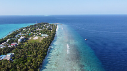 Maldives resort island drone aerial view, Indian ocean atoll nature beach and palm forest, leisure...