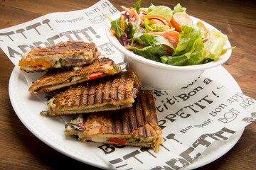 Pesto, salty cheese, olive oil, and Antipasti vegetables (sweet potato, onions, pepper, and eggplant).