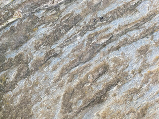 Surface texture of natural building solid gray strong concrete, rough cement with small pebbles. The background