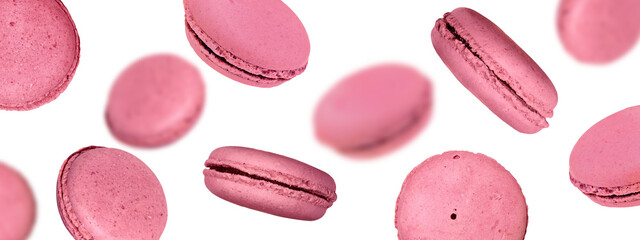 Macarons. Pink French Dessert, Selective Focus. Flying Macaroons isolated on White Background.