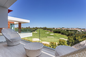 Beautiful view of Green Golf course landscape from luxury Balcony , with decorative chairs and...