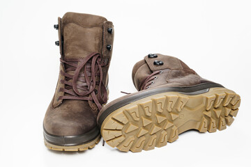 winter brown leather men's shoes with a fluted sole on a white background.