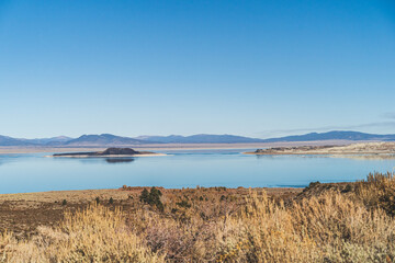 Mono lake, California in Autumn on sunny day with clear blue sky and tufa  - Powered by Adobe