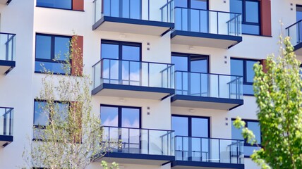 Condominium and apartment building with  symmetrical modern architecture in the city downtown.