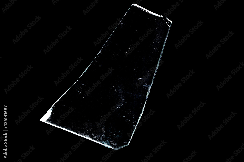 Poster glass fragments in isolation on a black background. damaged window. damaged object