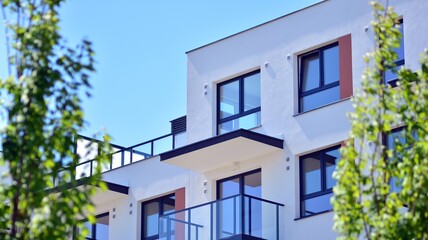 Condominium and apartment building with  symmetrical modern architecture in the city downtown.