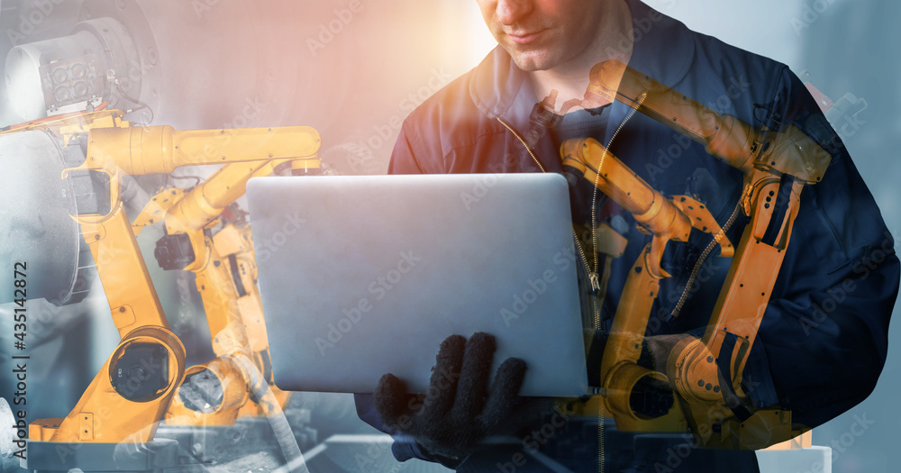 Poster mechanized industry robot arm and factory worker double exposure . concept of robotics technology fo
