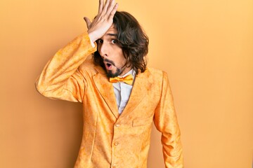 Young hispanic man wearing hipster elegant look surprised with hand on head for mistake, remember...