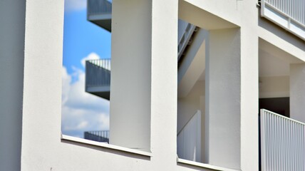 Condominium and apartment building with  symmetrical modern architecture in the city downtown.