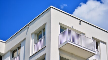 Condominium and apartment building with  symmetrical modern architecture in the city downtown.