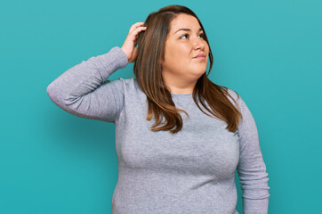 Beautiful brunette plus size woman wearing casual clothes confuse and wondering about question....