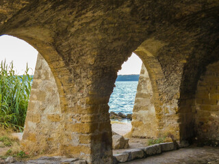Naklejka premium Magnificent old stone wash house from the 18th century called wash house of contagious on the edge of the Berre pond in Saint-Chamas in Provence in France