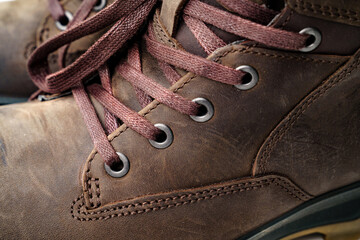 close up. part of winter brown leather men's shoes. shoelaces