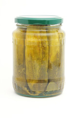 Pickled cucumbers in a glass jar on a white background