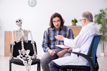 Young male patient visiting experienced doctor psychiatrist