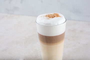 A view of a coffee drink in a glass.