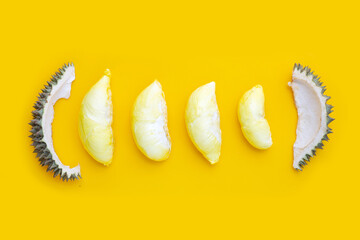 Fresh ripe cut durian on yellow background.