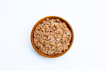 Canned tuna in wooden bowl on white background.