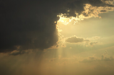 Obraz na płótnie Canvas Beautiful sunset sky above clouds with dramatic light