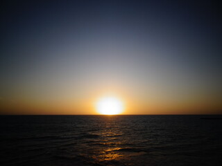 [Madagascar] The beach dyed orange and the sun setting on the horizon in Salary bay