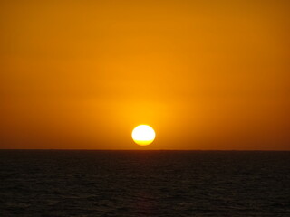 [Madagascar] The beach dyed orange and the sun setting on the horizon in Salary bay