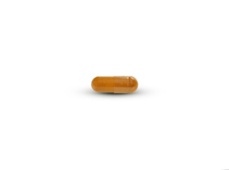  dry Turmeric  powder in  capsules isolated on white background.