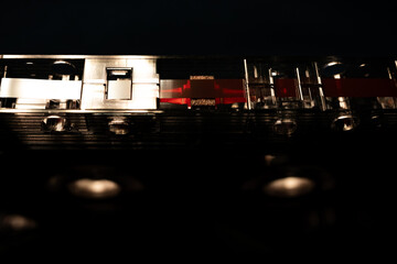 Macro Closeup of Red Tape on Bottom of Upside Down See Through Horizontal Cassette