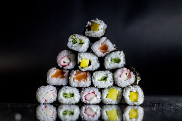 sushi pyramid with black background