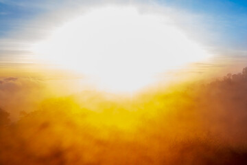 The over exposure of Sunlight Sunbeam or Sunray through the clouds with blue sky at sunrise on the...
