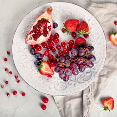 Various fresh forest berries on white background. Organic food concept.