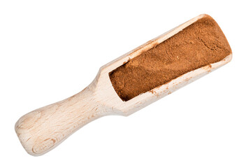 top view of cinnamon powder in wooden scoop