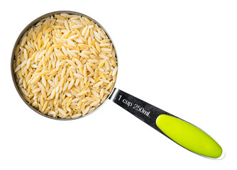 uncooked risoni pastina in measuring cup cutout