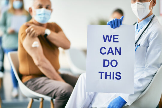 Close-up Of Doctor Showing Placard With 