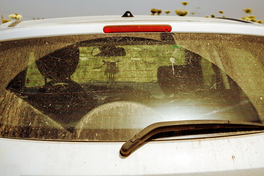 dirty rear window of the car after hamsin, texture, style grunge, space for text, space for copy