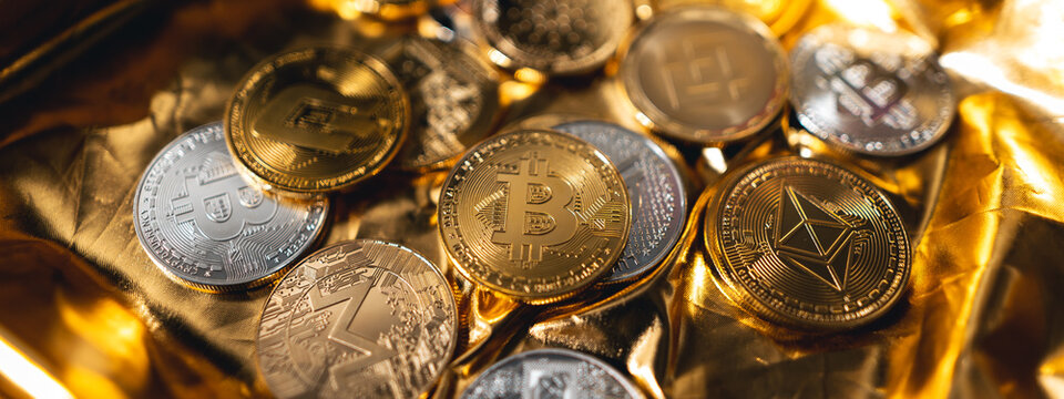 Crypto coins on gold background