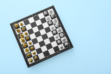 Game board with chess pieces on color background - Powered by Adobe