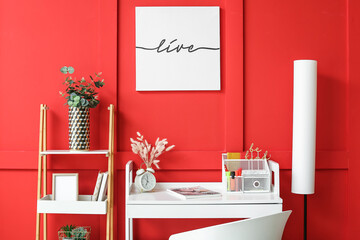Stylish workplace with organizer near color wall
