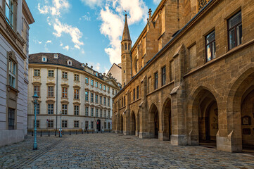 Fototapeta na wymiar Old stone church and cobblestone street in Vienna, Austria.