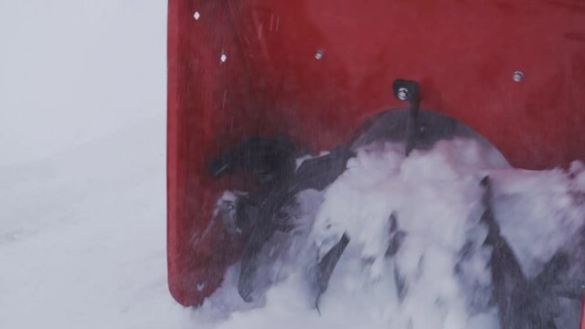Snow blower auger rotation close up in slow motion